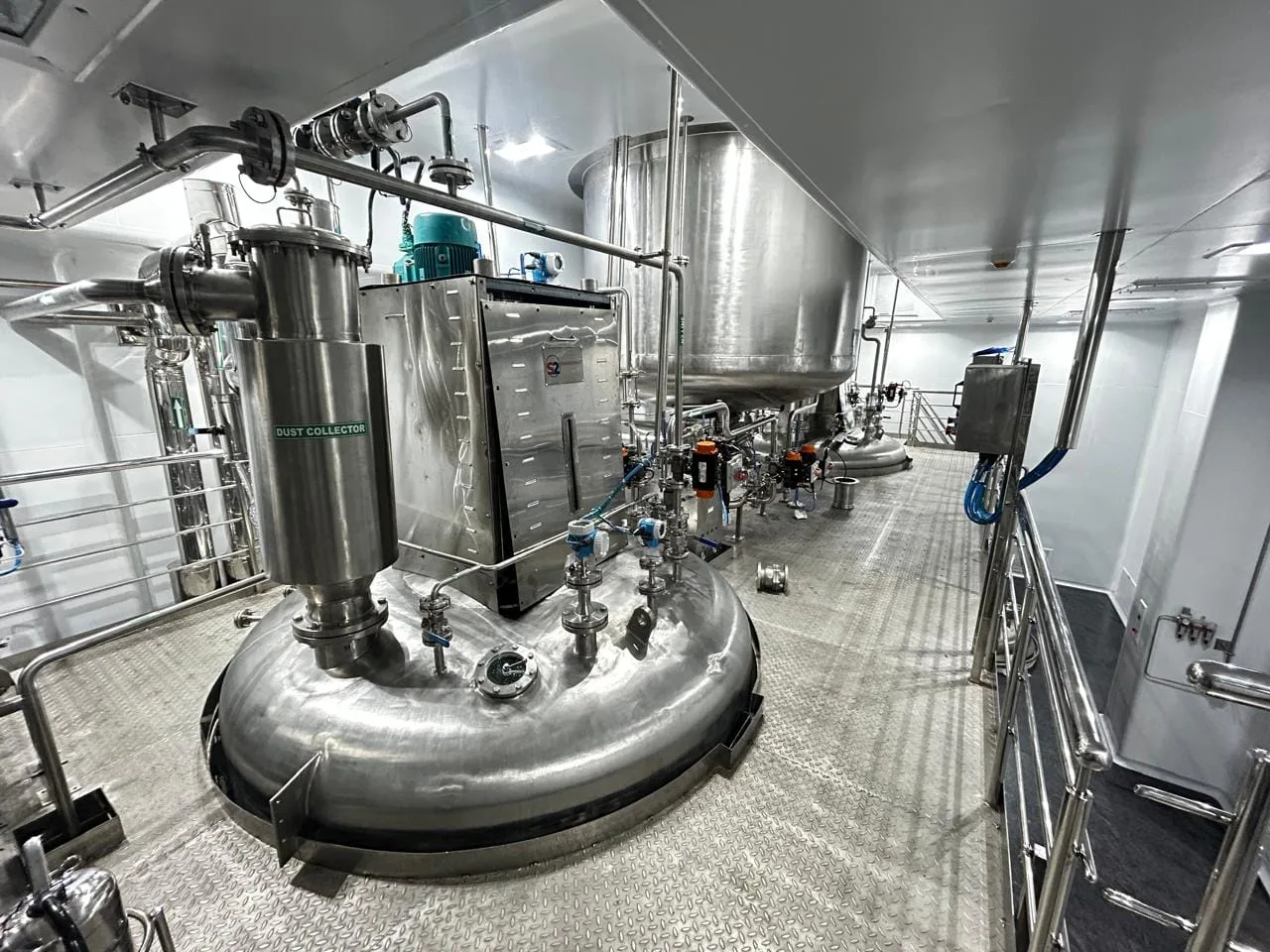 Dust collector and powder handling equipment in the contained solids suite of an API plant